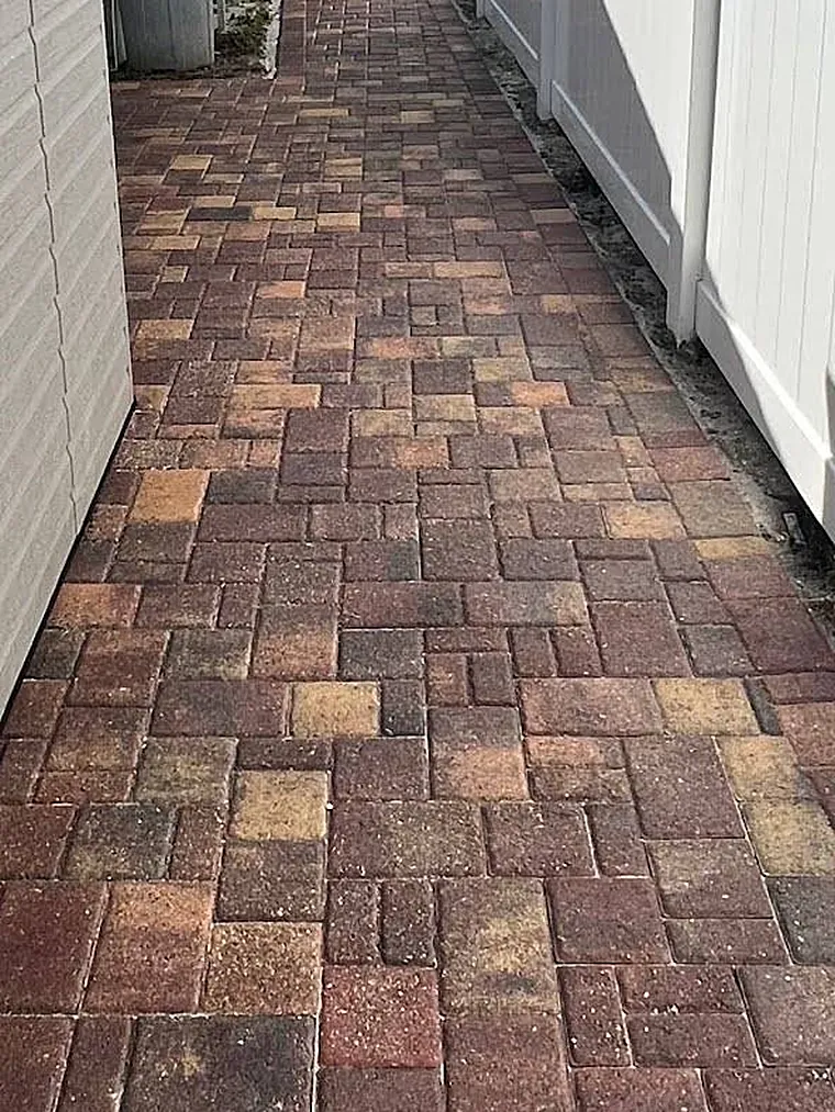 After: side-yard paver walkway with its rich red color brought back
